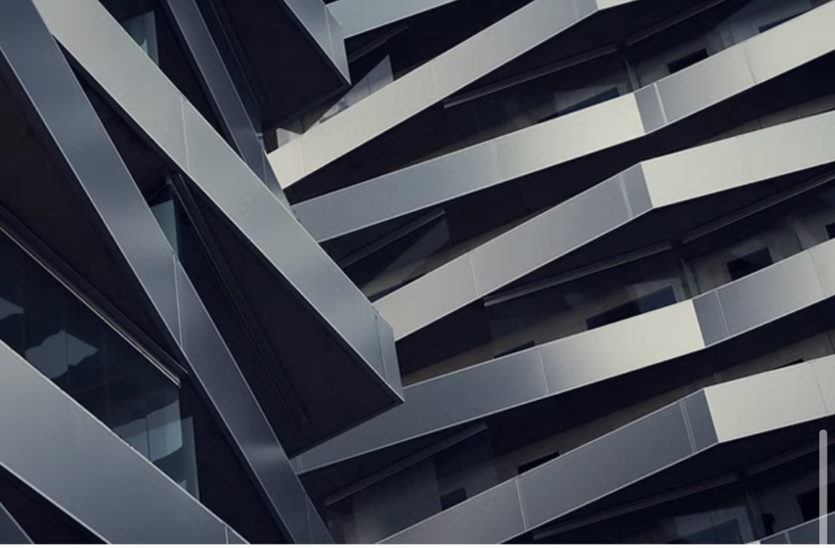Angular steel facade panels on a modern building, each at a different angle